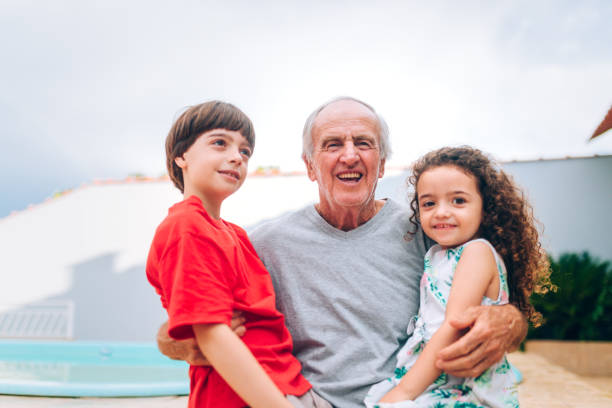 istock Grandfather spending time with grandchildren 1225165119