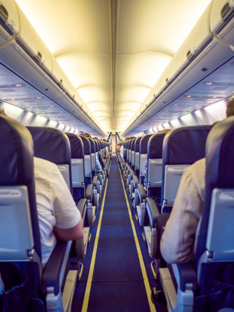 istock Saloon aircraft with passengers during the flight 1225165393