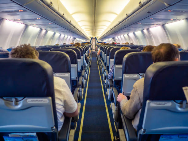 istock Saloon aircraft with passengers during the flight 1225165407