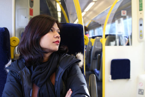 istock A beautiful woman travelling solo onboard the train 1225168611