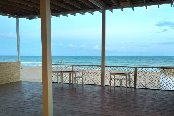 istock empty terrace with tables and sea view 1225168768