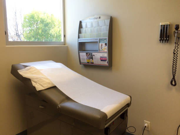 istock Examination table bed at doctor office 1225169887