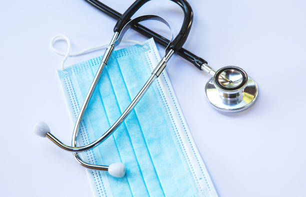istock close-up of blue facemask and stethoscope on white background 1225170142