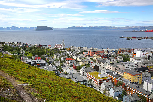 Town of Hammerfest with the downtown area, and cathedral with mountains & fjords in the background. Hammerfest is the northernmost town in the world with more than 10,000 inhabitants, county, Norway.