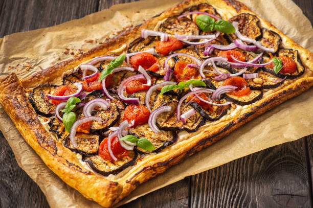 istock Eggplant tart with tomatoes , red onion and cheese. 1225171483