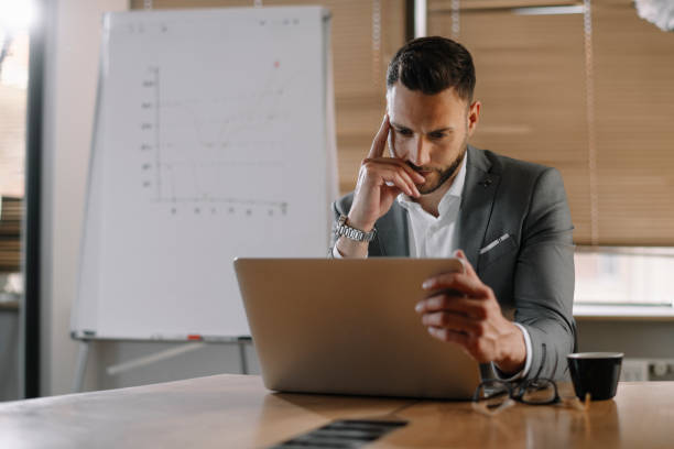 istock Handsome businessman working on lap top. 1225172169