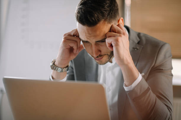 istock Handsome businessman working on lap top. 1225172245
