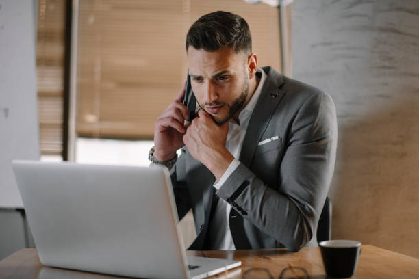 istock Handsome businessman working on lap top. 1225172384