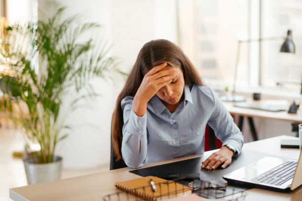 istock Tired businesswoman working in office. 1225172692