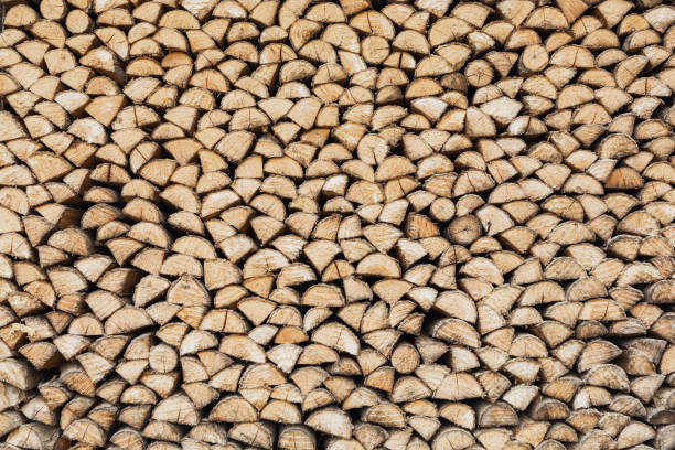 Precisely layered pile of wood from different cut firewood, heating material