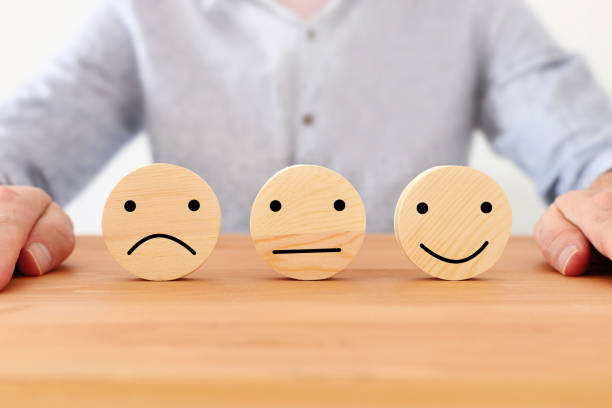 istock Concept image of satisfaction level. wooden circles with emotions 1225177598