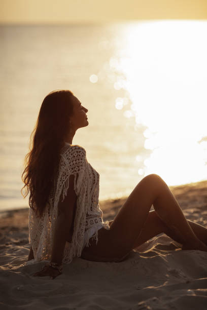 istock Woman Resting on the Beach During Vacations 1225177876