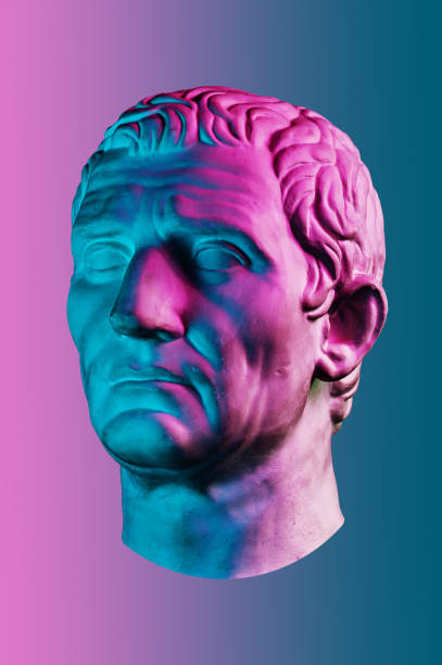 istock Statue of Guy Julius Caesar Octavian Augustus. Creative concept colorful neon image with ancient roman sculpture Guy Julius Caesar Octavian Augustus head. Cyberpunk, vaporwave and surreal art style. 1225179247