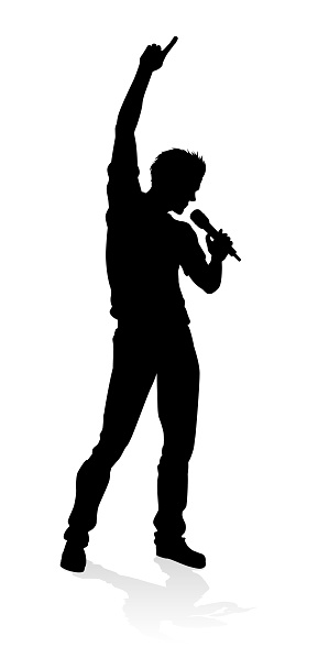 A singer pop, country music, rock star or hiphop rapper artist vocalist singing in silhouette