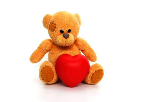 istock Teddy bear with a red heart on a white background. 1225187727
