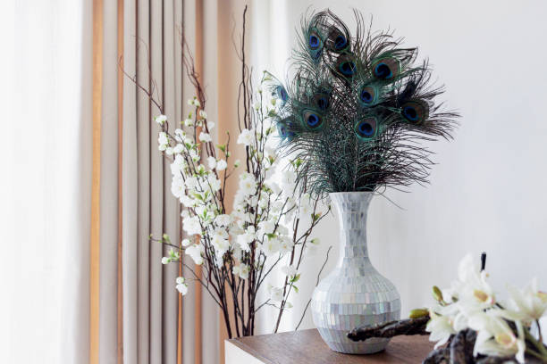 Quaint Corner of a Luxrious Villa Living Room with beautiful decoratives Luxury, Furniture, Interior - Tastefully decorated luxurious living room corner of a villa peacock feathers in vase stock pictures, royalty-free photos & images