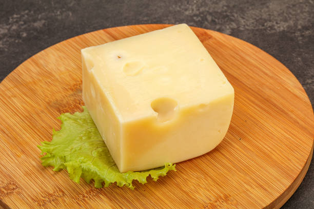 istock Emmental cheese over wooden board 1225191114