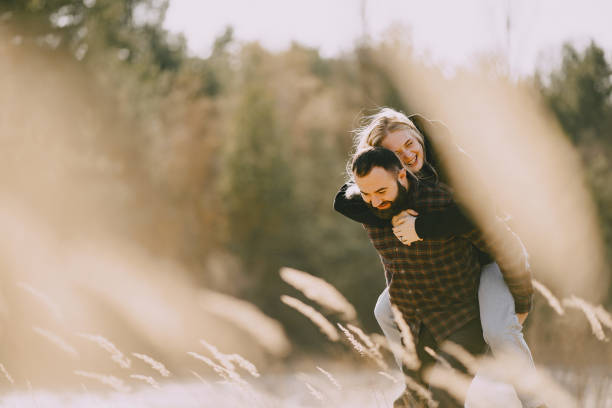 istock Beautiful couple spend time in a autumn field 1225191172