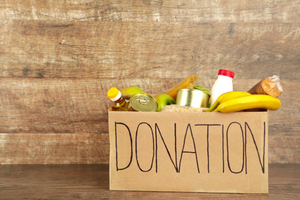 istock Donation box with food on the brown background 1225192174