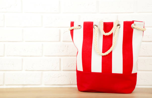 Red summer bag on white background. Beach accessories