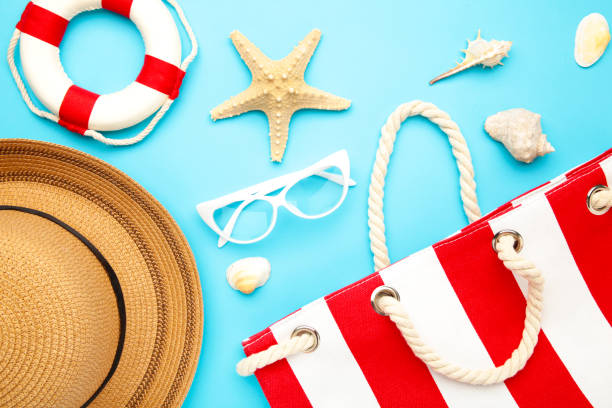 istock Beach accessories on blue background. Top view 1225192350