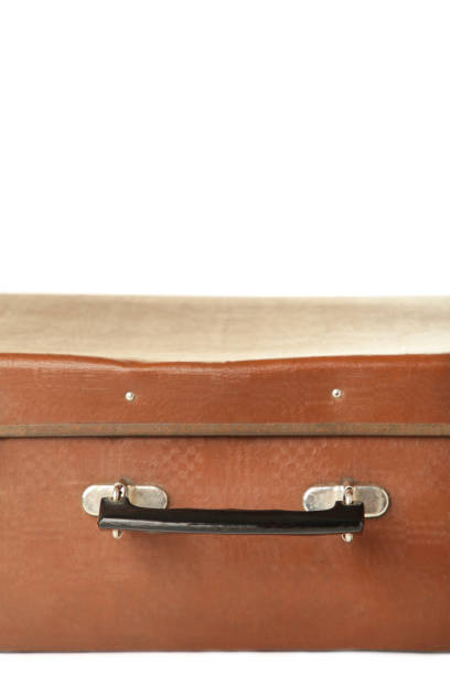 istock Vintage leather suitcase on isolated white background 1225192435