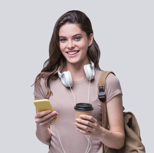istock Happy student girl using smart phone and going on a travel 1225192438