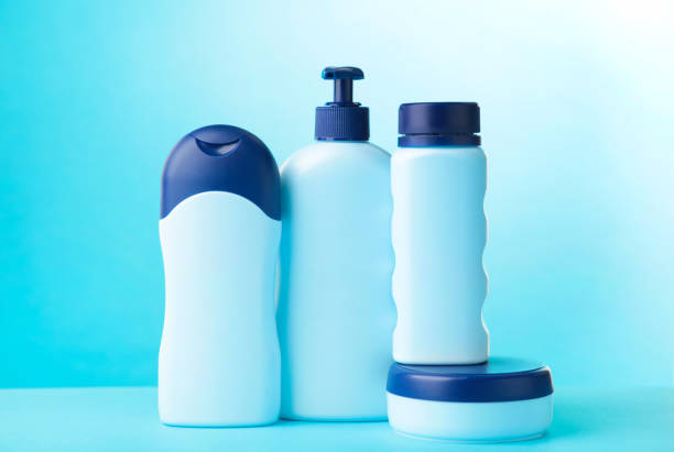 istock Blue cosmetic bottles on blue background. Top view 1225192617