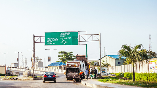 Lagos, Nigeria - Workers dealing with city garbage in Surulere district.