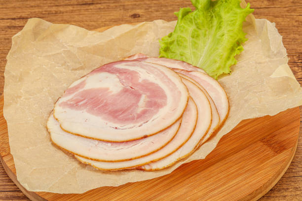 Sliced Italian Pancetta sausage over board