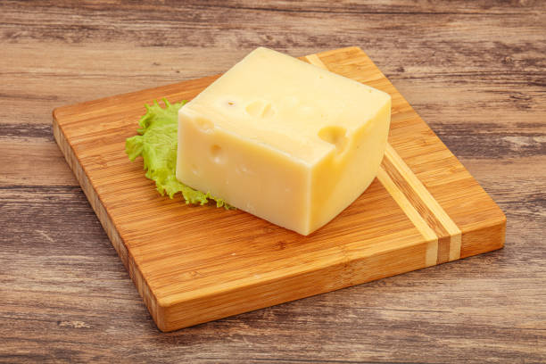 istock Emmental cheese over wooden board 1225196177