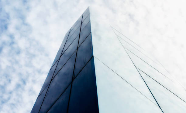 istock wall of a modern building against the sky and clouds 1225198705