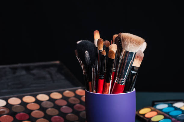 istock set of professional makeup brushes on a palette background with colored eye shadows 1225200453