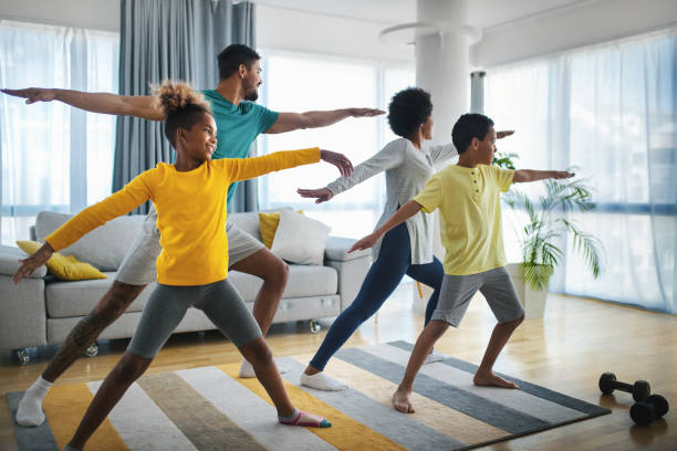 istock Family exercising at home 1225202676