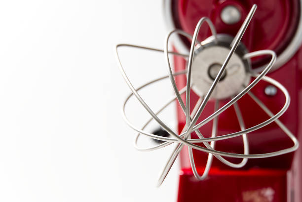 Stylish Red Kitchen Mixer With Clipping Path Isolated On White Background. Professional steel electric mixer with Metal Whisk.