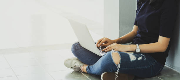 Back to school education knowledge college university concept. Female student study in library using laptop and searching internet