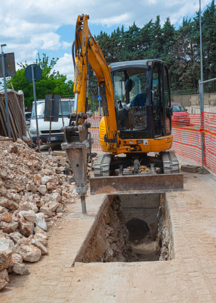 istock Head of Excavator is drilling road. 1225212368