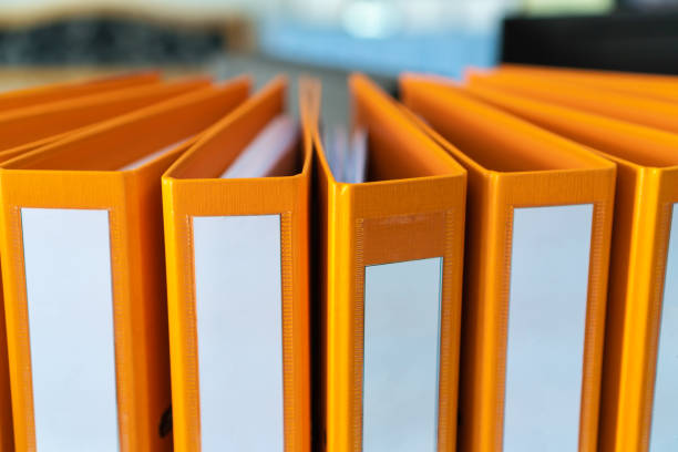 istock Documents Binder Paper with blank label,Orange Files folder on office desk, Annual Report document for Business papers financial market in offices, lawyer research achieves.Concept work in information 1225213489