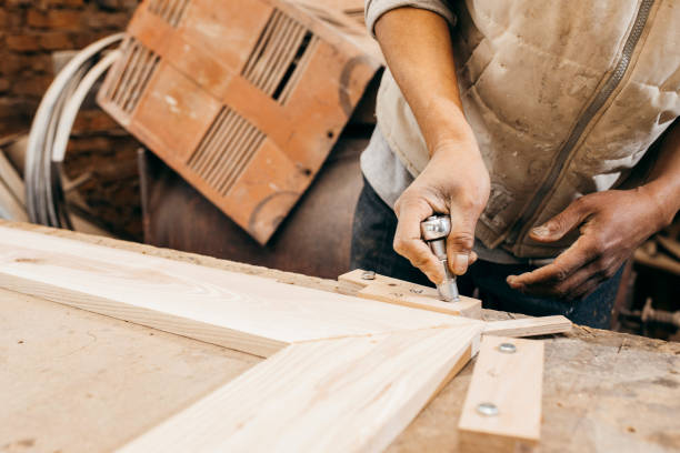 istock The joiner fix the woodwork in the carpentry 1225213639