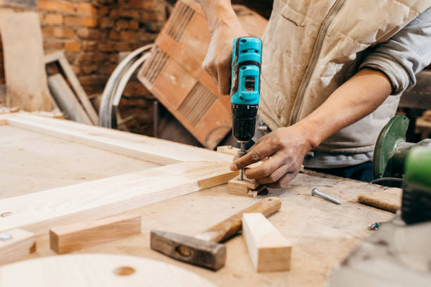 istock The joiner fix the woodwork in the carpentry 1225213695