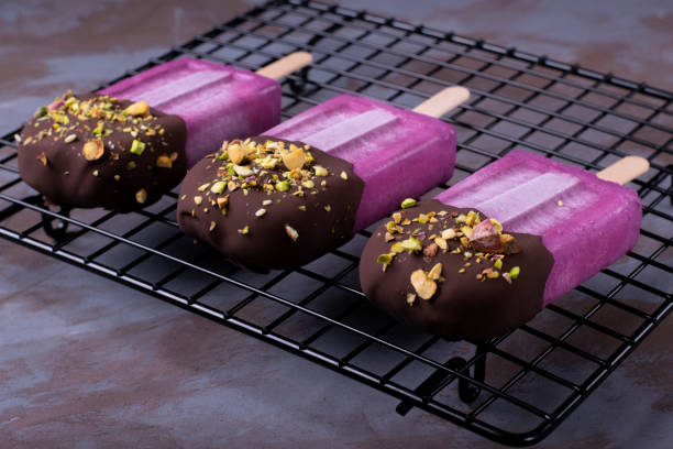 istock Bilberry ice-cream decorated with chocolate and pistachio nuts 1225218284
