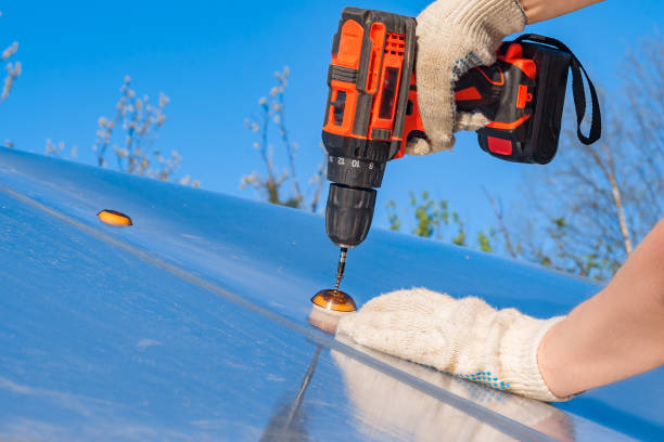 istock Power electric screwdriver. A man works with a hand-held power tool, close-up. 1225218804