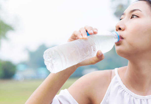istock The women thirsty drinking  water. 1225222416