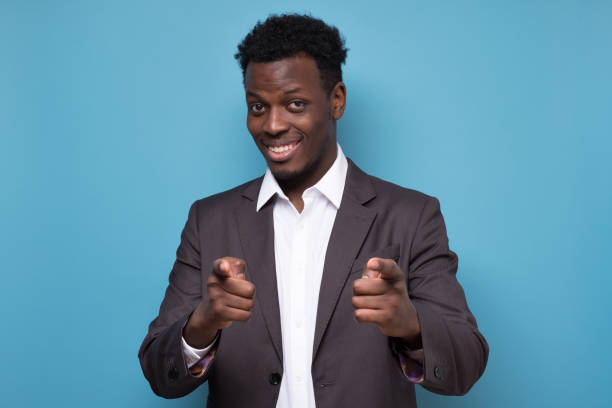 istock Cheerful attractive african man pointing on you making a choice. 1225223110