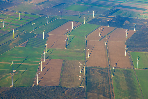 fields with wind turbines aerial view