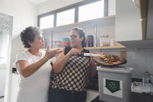 istock Women separating organic waste in a recycle bin 1225223386