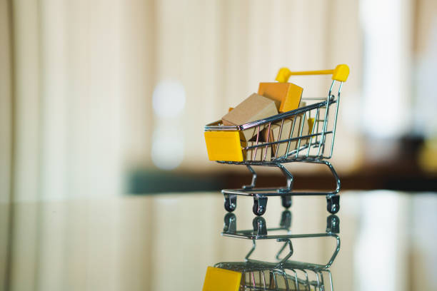 Mini shopping cart contain paper box using as e-commerce, online shopping and business marketing concept
