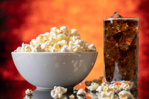 istock Glass bowl with fresh popcorn and cola 1225224918