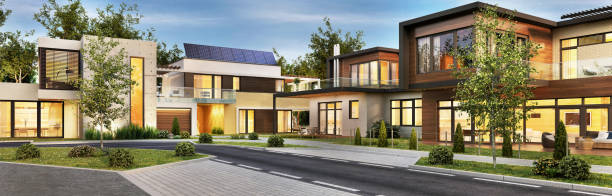 Street with modern houses Street with modern and beautiful houses. Evening view. solar panels on the roof of building in a city stock pictures, royalty-free photos & images