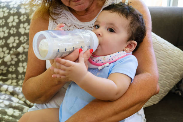 istock Beautiful Baby Girl Feeding 1225229069